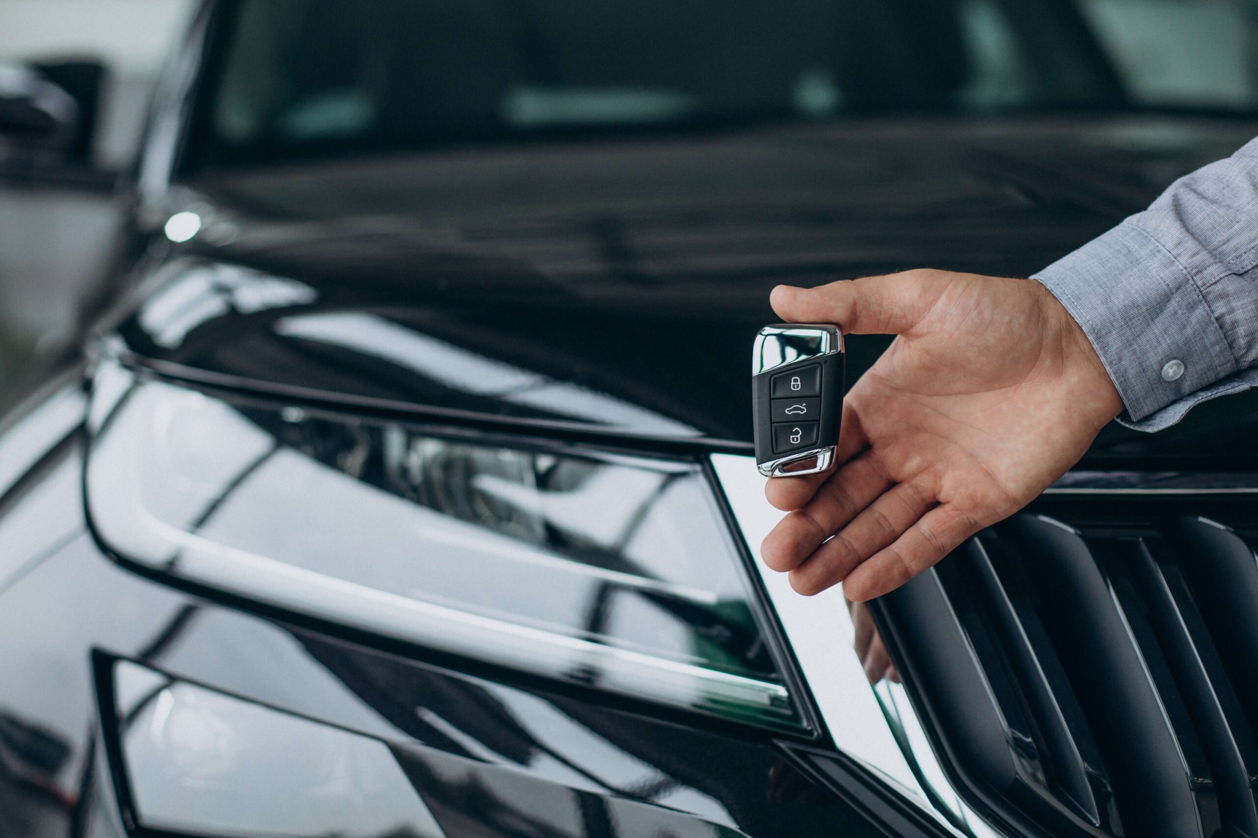 Premium Photo  Hand of locksmith copying car key with key copy  machine.close view of key copying machine with key. duplicate machine make  new key